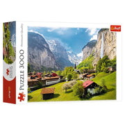 Lauterbrunnen Switzerland 3000 Piece Puzzle - 3000-piece puzzle box featuring a vibrant Lauterbrunnen valley with green fields, rustic houses, and towering cliffs under a