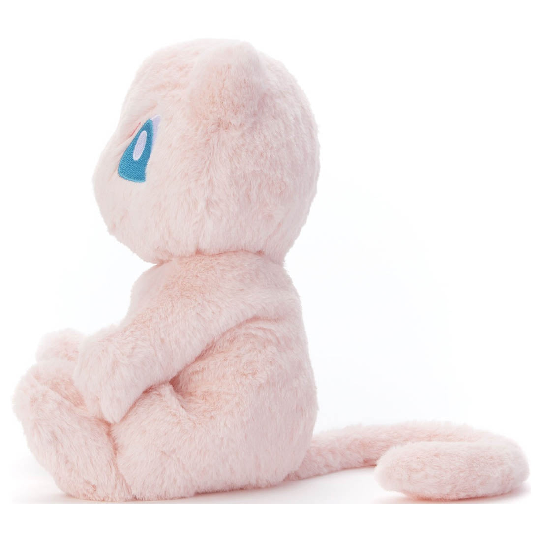 Pokemon Plush: Mew - Soft light pink Mew plush with large blue eyes, sitting pose, long tail, fuzzy texture.