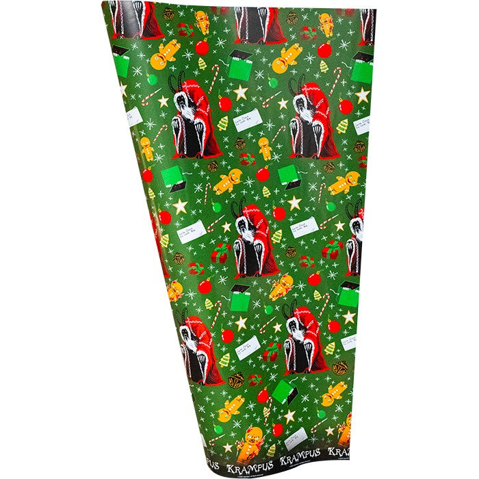 Trick or Treat Wrapping Paper: Krampus - Seasons Greetings - Green wrapping paper with repeating Krampus illustrations, red berries, gold stars, candy, and white "Seasons Greetings".