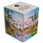 Deck Box: Alcove Flip: Bob Ross: Mighty Mountain Lake - Rectangular deck box with colorful mountain lake landscape painting featuring trees, water, and snow-capped peaks, signature