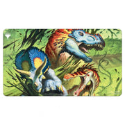 Ultra Pro Playmat -Magic the Gathering: Commander Masters: Finale of Devastation - Rectangular playmat featuring vibrant dinosaurs with bright blue, red, and orange tones on a green jungle background.