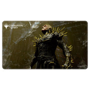 Playmat: MtG: Commander Series: K'rrik, Son of Yawgmoth - Dark fantasy playmat featuring a menacing armored figure with golden spikes and a skeletal mask against a smoky textured.