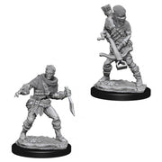 Wizkids Deep Cut: Bandits W4 - Two gray plastic fantasy miniatures of bandits on round black bases, one wielding a dagger in a crouched pose, the other.