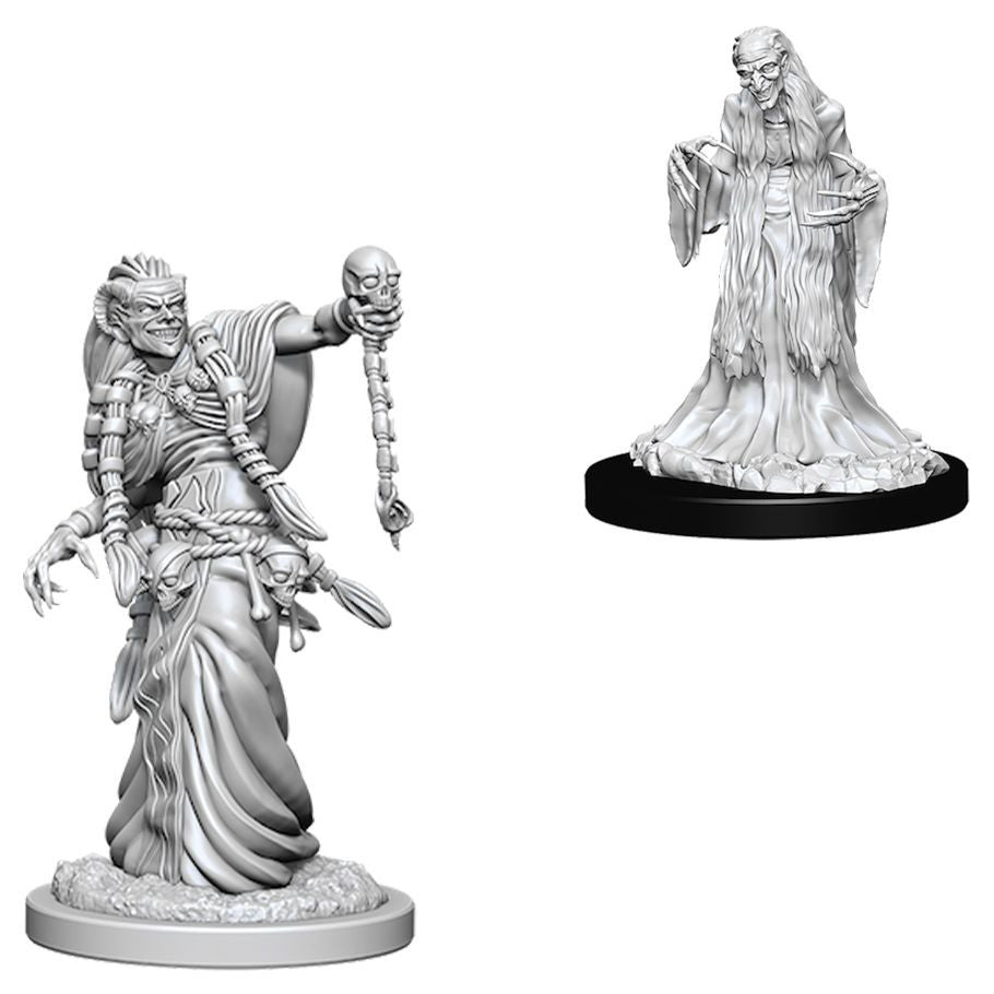 D&D Nolzur's Marvelous Miniatures: Green Hag & Night Hag - Two unpainted resin miniatures featuring detailed fantasy hags; one holding a skull staff with flowing robes, the other with