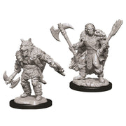 D&D Nolzur's Marvelous Minis: Male Half Orc Barbarian - Two unpainted gray resin miniatures of male half-orc barbarians, one holding two axes, the other wielding a large axe and.