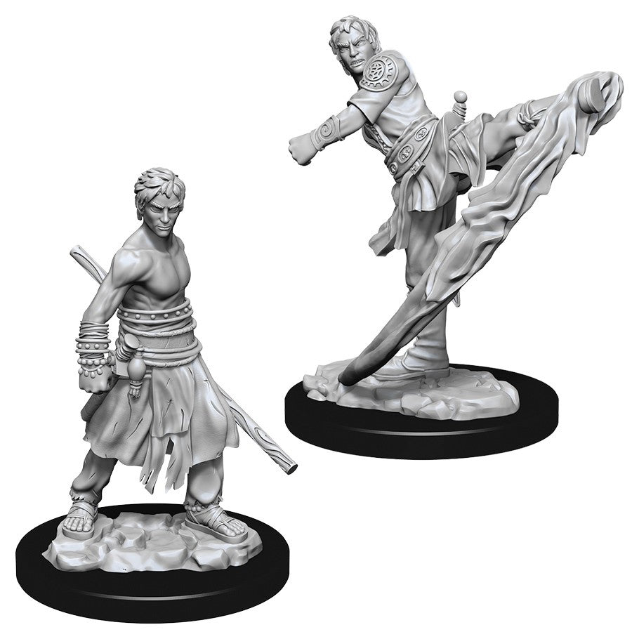 D&D Nolzur's Marvelous Minis: Male Half-Elf Monk - Gray plastic miniature of a male half-elf monk in dynamic martial arts poses, detailed clothing and weapons, mounted on.