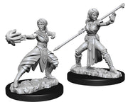 D&D Nolzur's Marvelous Miniatures: Female Half-Elf Monk - Two gray plastic fantasy miniatures of a female half-elf monk, one casting a spell with an open hand and the other wielding.