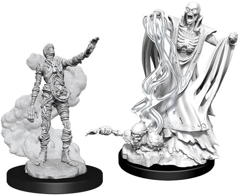 D&D Nolzur's Marvelous Miniatures: Lich & Mummy Lord - Two unpainted gray resin miniatures on black bases, one depicting a robed skeletal lich with flowing robes and a raised arm,