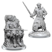 Deep Cuts: Dead Warlord - Two unpainted fantasy miniatures, one a wounded warrior on a throne with armor and sword, the other a standing armored.