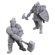 D&D Nolzur's Marvelous Miniatures: Limited Edition 50th Anniversary: Dwarves - Two gray unpainted resin dwarf miniatures, one wielding a large hammer in a ready stance, the other holding a warhammer and.