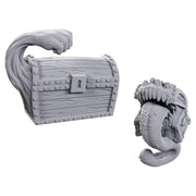 D&D Nolzur's Marvelous Miniatures: Limited Edition 50th Anniversary: Mimics - Gray plastic miniature of a treasure chest with wood grain texture and a lock, transforming into a monster with large teeth.