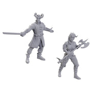 D&D Nolzur's Marvelous Miniatures: Special Edition Baldur's Gate 3: Wyll & Karlach - Two unpainted gray plastic Dungeons & Dragons miniatures, one with horns and sword, the other wielding a double-bladed axe.