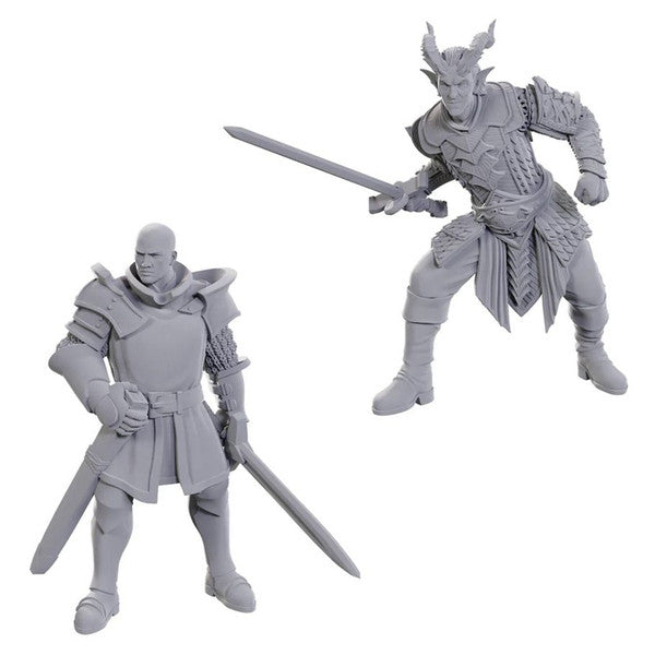 D&D Nolzur's Marvelous Miniatures: Special Edition Baldur's Gate 3: Ulder Ravengard & Zevlor - Two unpainted gray resin miniatures depicting armored fantasy warriors; one with bald head holding a sword, the other horned