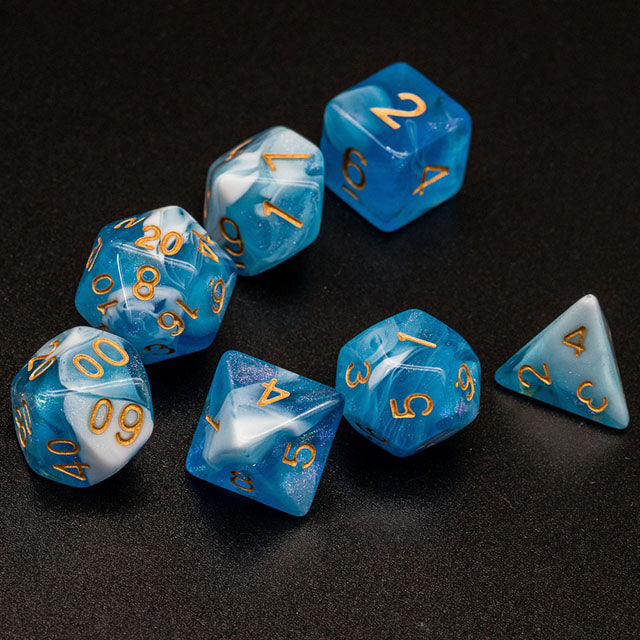 Blue & White Glitter Acrylic Dice Set - Set of seven blue and white glitter acrylic dice with gold numbers on black background.