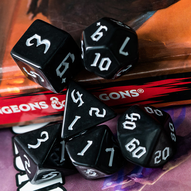 Black Acrylic Dice Set - White - Black acrylic polyhedral dice set with white numbers, including d4, d6, d8, d10, d12, and d20 shapes.