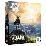 Puzzle: Zelda Breath Of The Wild 1000pc - 1000-piece Zelda Breath of the Wild puzzle box featuring hero Link overlooking a vast landscape at sunrise.