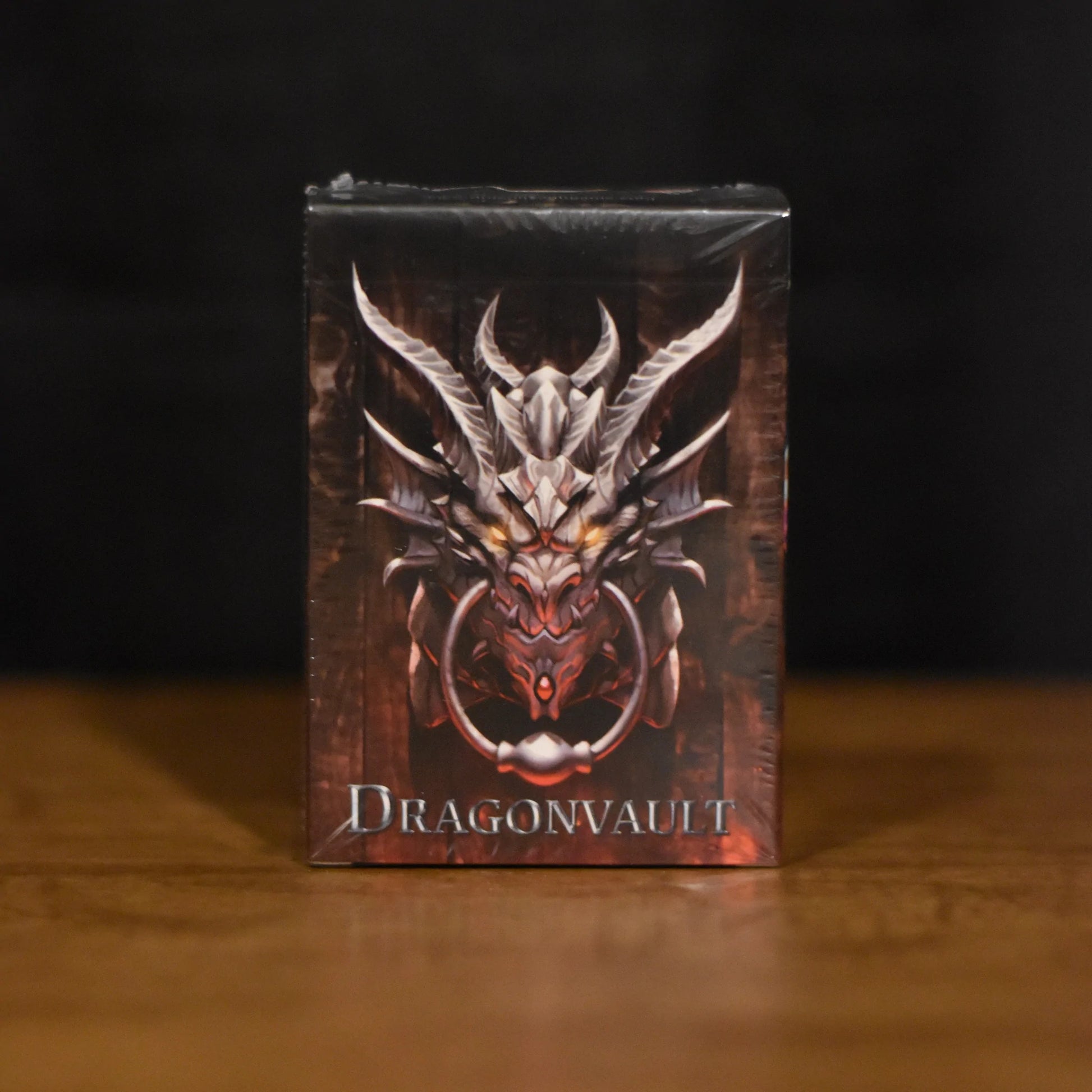 Dragonvault: Original Game - Compact Dragonvault card game box with fierce silver dragon emblem on dark background.