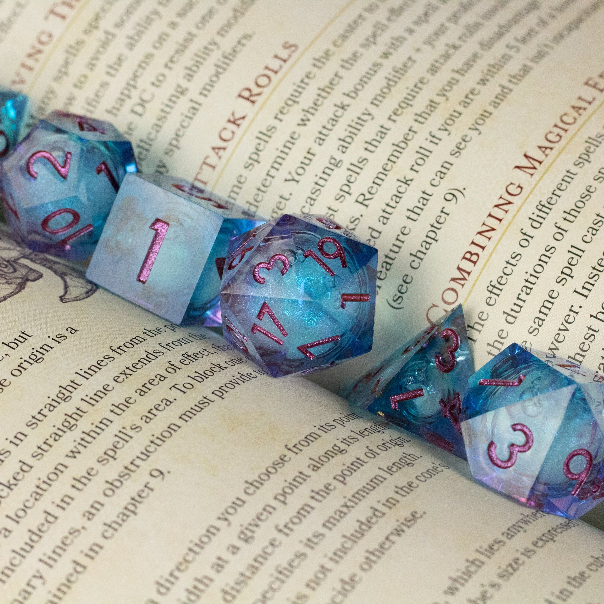 Crystallomancy Dice Set - Blue translucent polyhedral dice set with red numbers and a liquid core effect, featuring sharp edges.