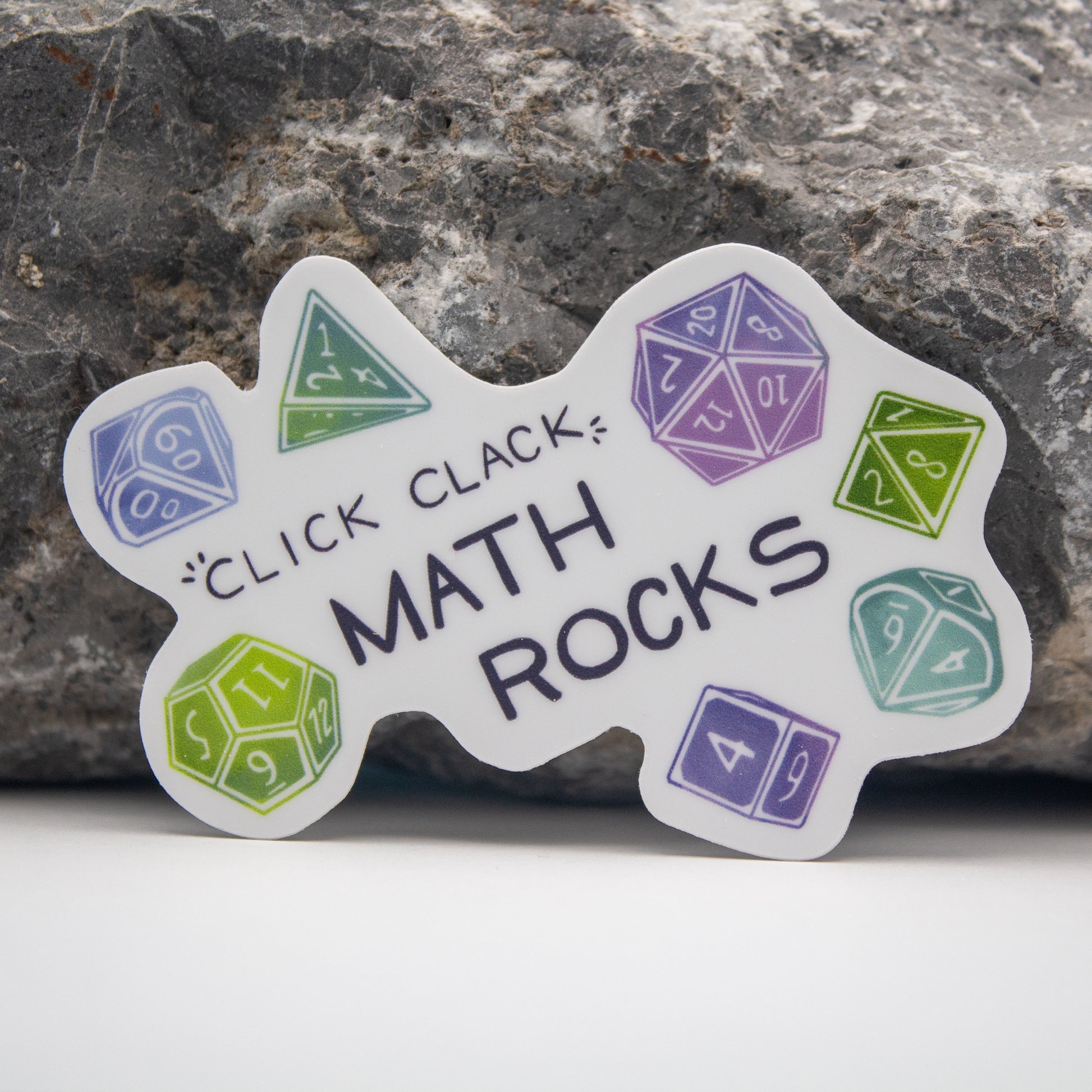 Math Rocks DnD Sticker - Sticker with colorful polyhedral dice and text "Click Clack Math Rocks" on white background.