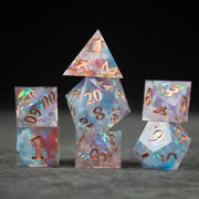 Divination Dice Set - Set of translucent sharp-edged dice with colorful swirls and metallic gold numbers, including d20, d12, d10, d8, d6, and d4.