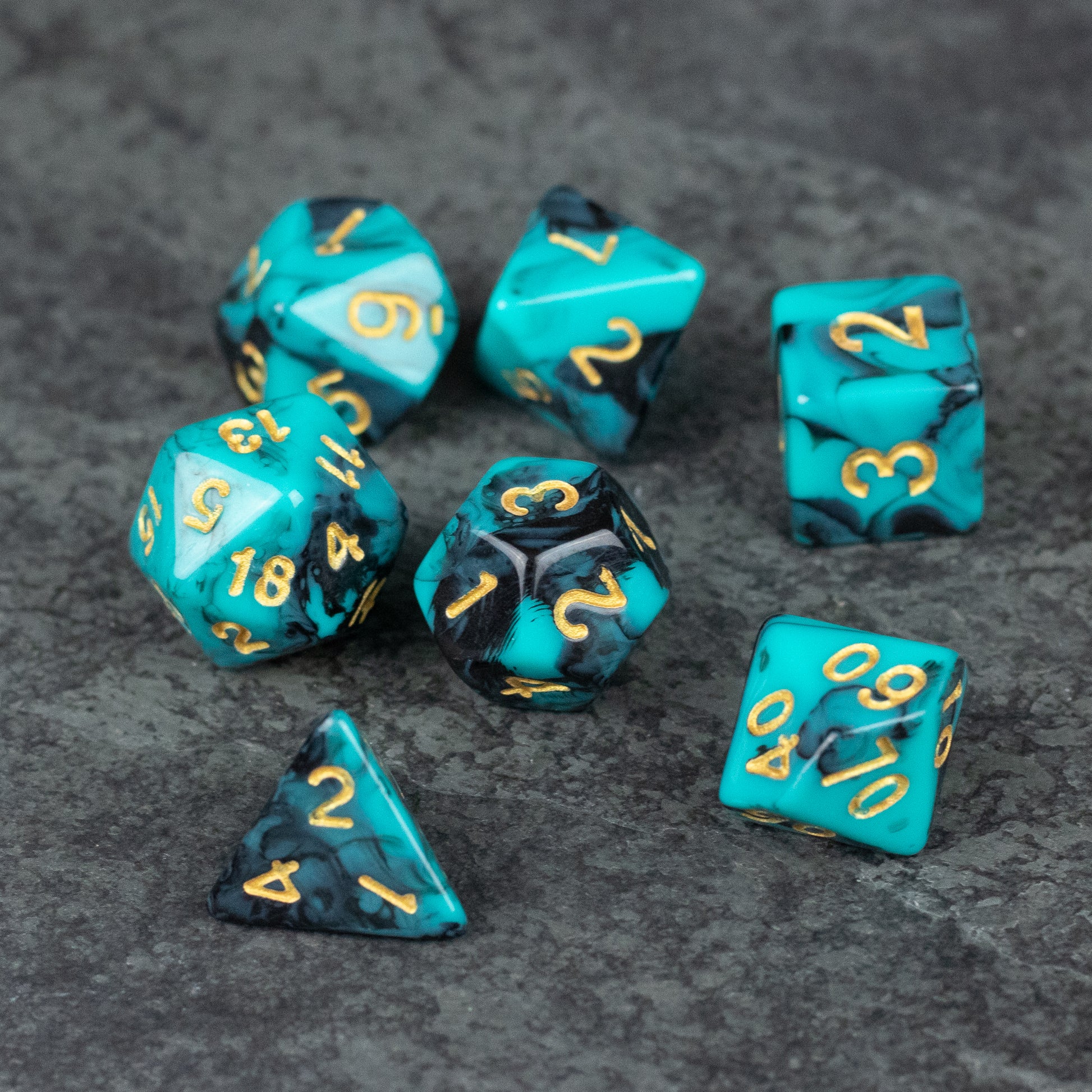 Mint and Black Marbled Dice Set - Set of polyhedral acrylic dice in mint green and black marbled pattern with gold numbers.