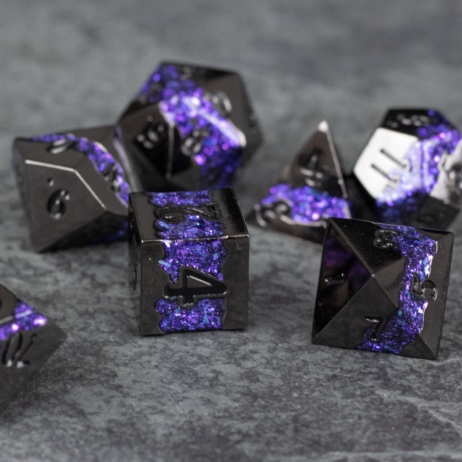 Purple Rift Dice Set - Black metal dice set with purple glittery rift design, including d20, d12, d8, and d6 shapes.
