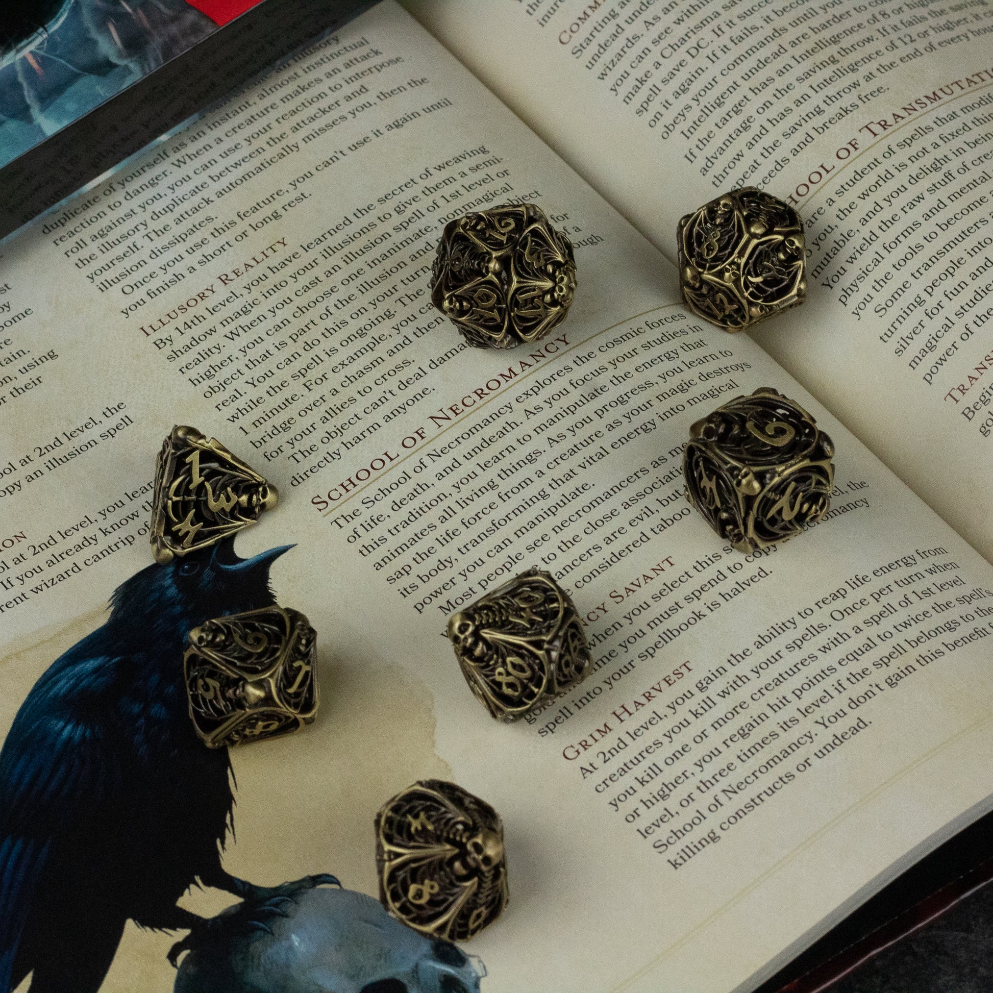 Bone Crypt Dice Set - Dark metallic polyhedral dice set with intricate skull and bone designs on each face, resting on an open book.