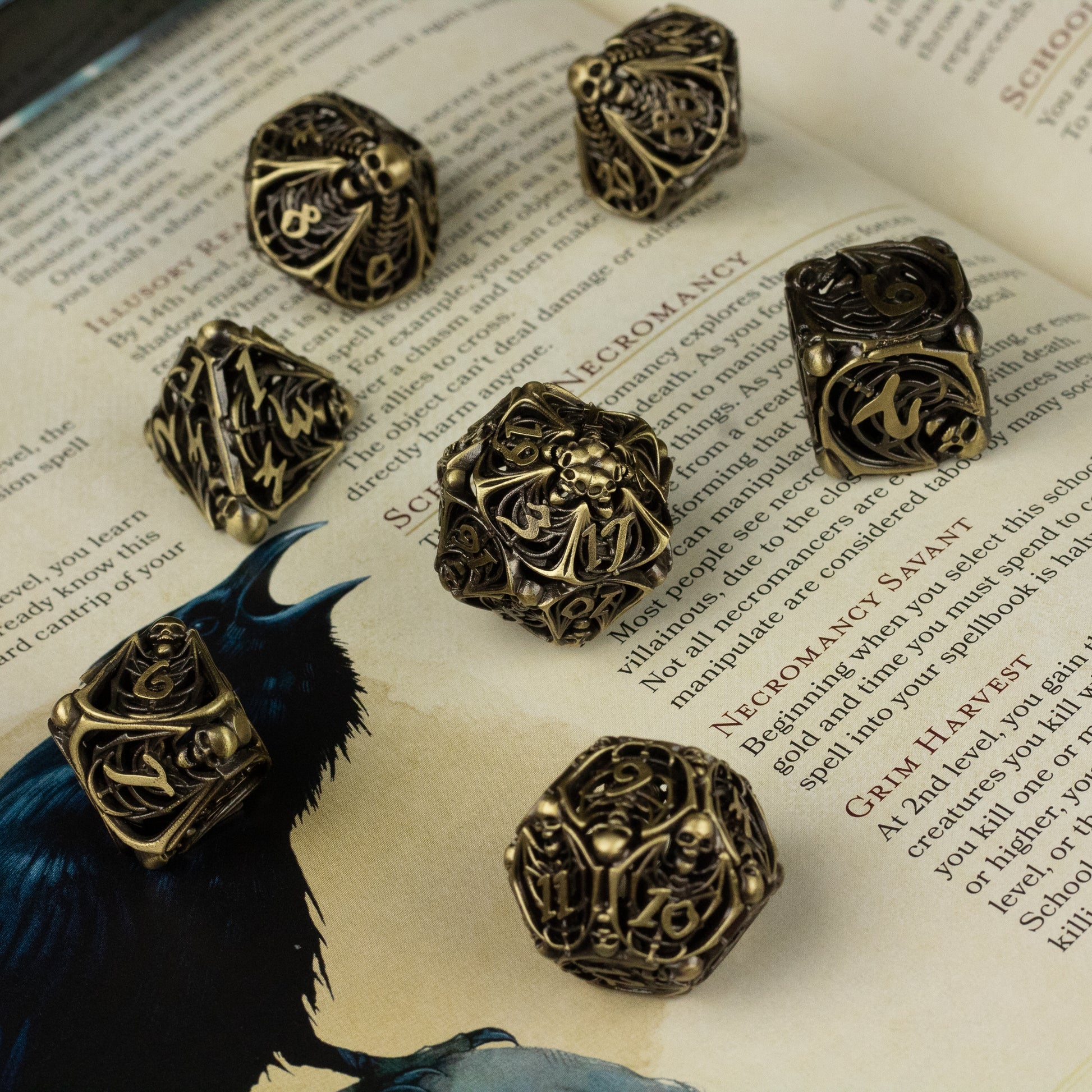 Bone Crypt Dice Set - Set of seven hollow metal dice with intricate bone-like carvings and gold numbering on dark bronze finish.