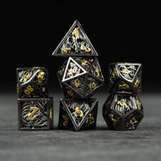 Black and Gold Dragon Hollow Dice Set - Black and gold hollow metal polyhedral dice set with dragon designs on dark background.