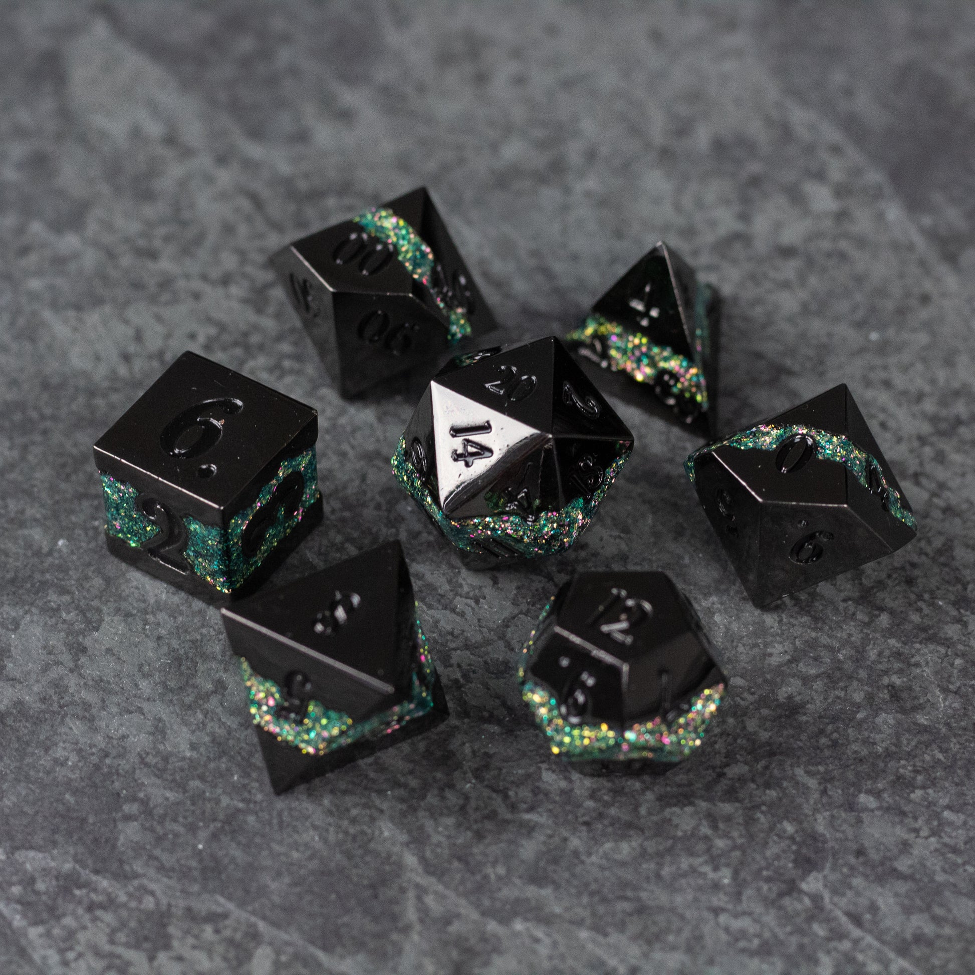 Light Green Rift Dice Set - Black metal polyhedral dice set with light green and iridescent glitter accents on dark gray background.