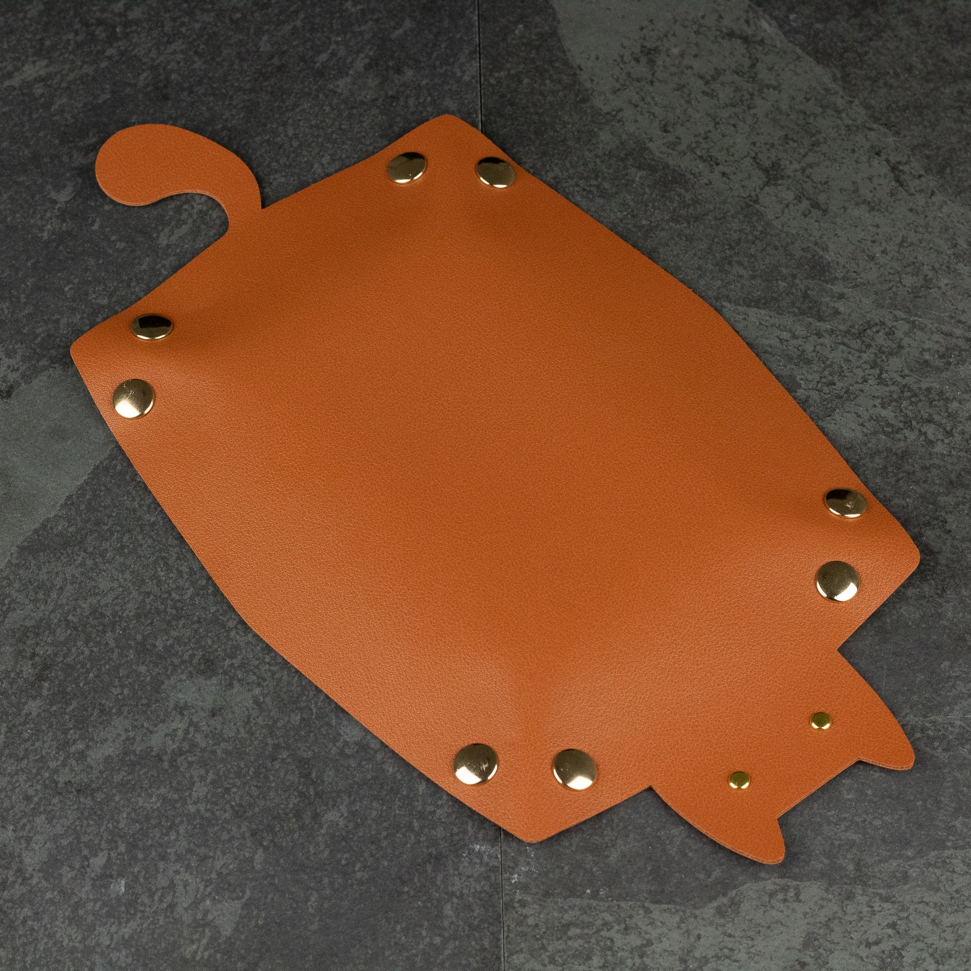 Cat Shaped Dice Tray - Orange leather dice tray shaped like a cat with metal snap buttons at corners and tail-shaped flap.