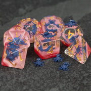 Dark Blue Octopus Dice Set - Translucent dark blue octopus-themed dice set with gold numbering and pinkish-red base accents.