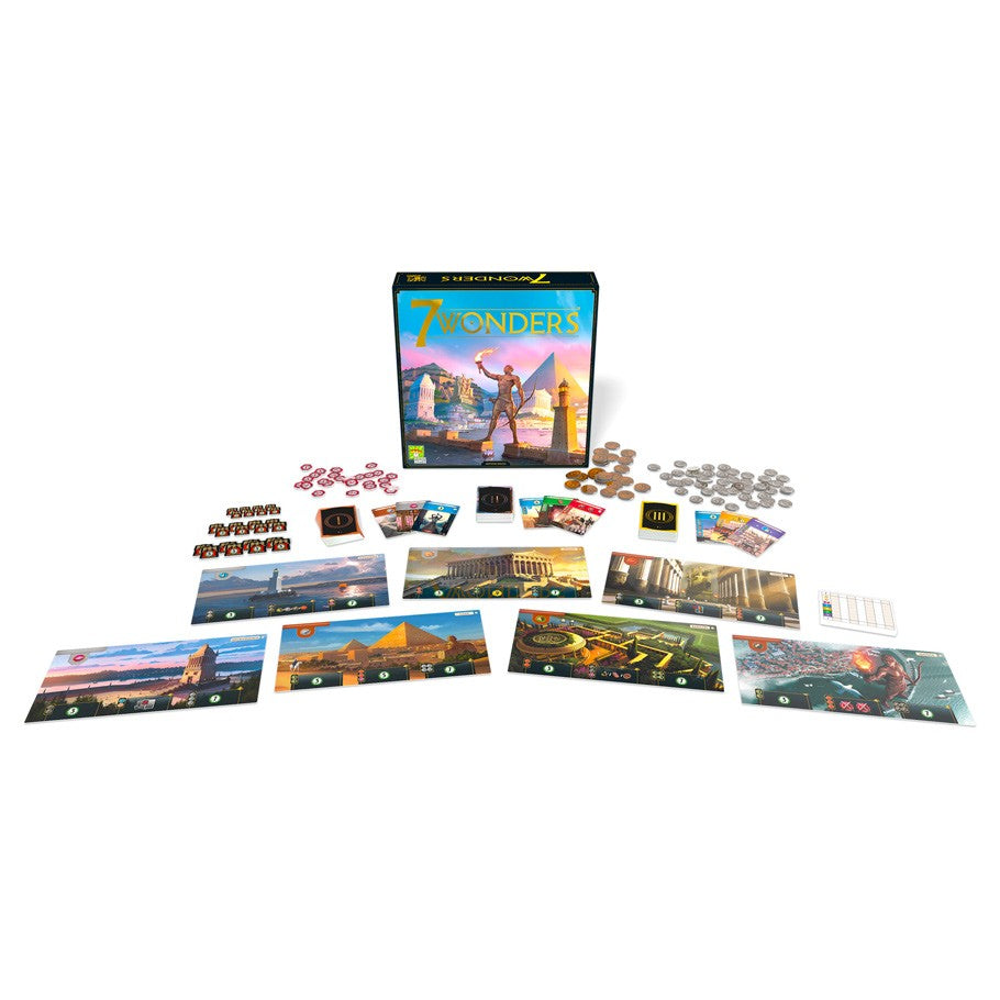 7 Wonders New Edition - 7 Wonders New Edition board game with cards, tokens, and colorful wonder boards arranged on white surface.