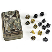 RPG Class Dice Set: Paladin - Metallic gold and black polyhedral dice set with matching tin featuring armored paladin artwork and "The Paladin" text.