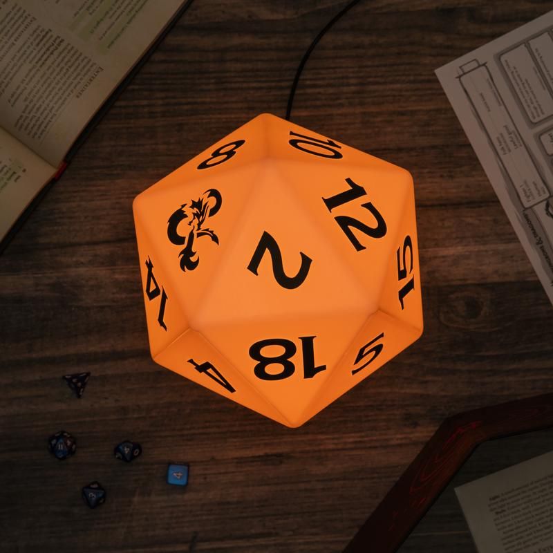 Color Changing D20 Light - Orange glowing 20-sided die lamp with black numbers on wooden surface.