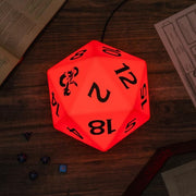 Color Changing D20 Light - Red glowing 20-sided dice lamp with black numbers and symbols on wooden surface.