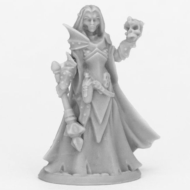 Dark Elf Priestess - Unpainted dark elf priestess miniature holding a skull and staff with flowing robes and intricate armor details.