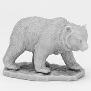 Bones Black: Cave Bear - Gray plastic miniature of a cave bear walking on textured base with detailed fur and facial features.